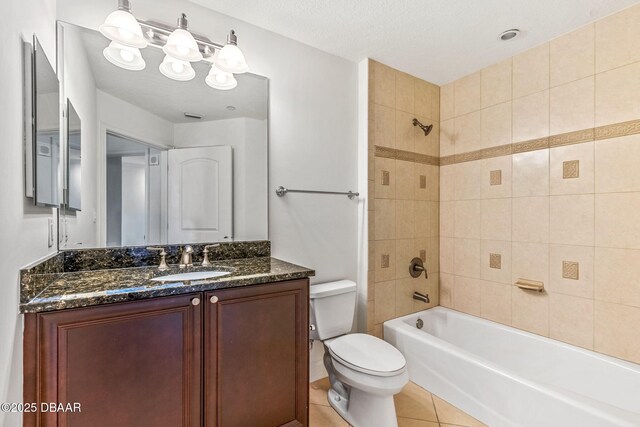 2515 S Atlantic Ave Unit 507, Daytona Beach Shores, FL 32118 - full bath featuring vanity,  shower combination, and tile patterned floors