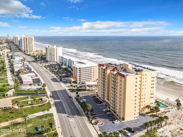 aerial view featuring a view of the beach and a water view