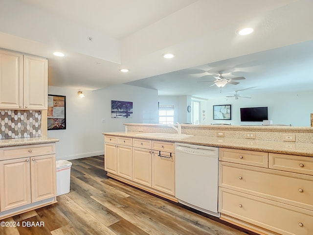 kitchen featuring wood-type flooring, backsplash, sink, dishwasher, and ceiling fan