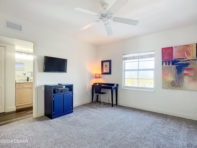 interior space with carpet and ceiling fan