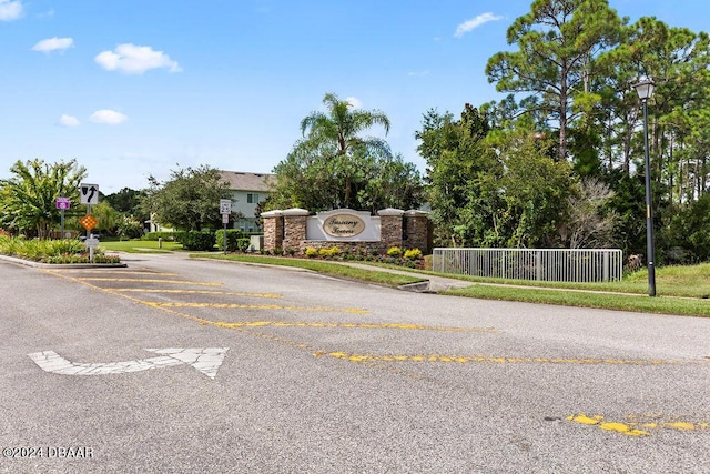 161 Tarracina Way, Daytona Beach, FL 32117 - view of asphalt road with traffic signs, street lights, and sidewalks
