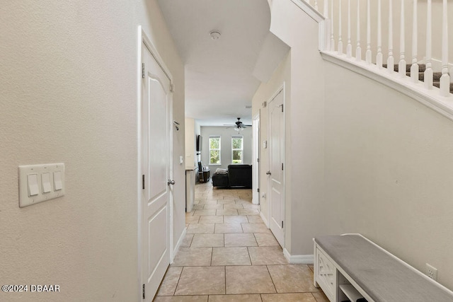 hall with light tile patterned flooring