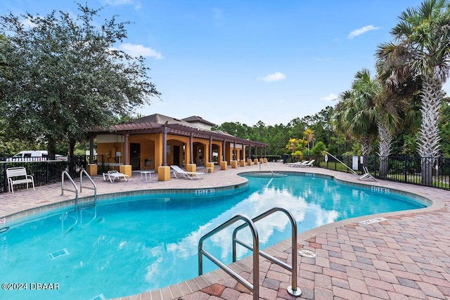 161 Tarracina Way, Daytona Beach, FL 32117 - community pool with fence and a patio area