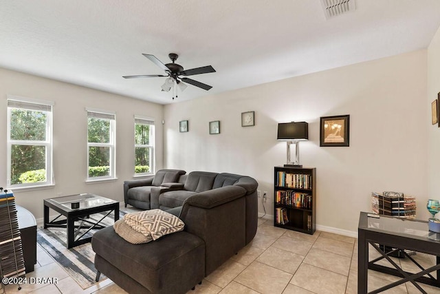 161 Tarracina Way, Daytona Beach, FL 32117 - living room with plenty of natural light, a ceiling fan, baseboards, and light tile patterned flooring