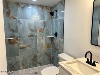 124 Harrison Rd, Daytona Beach, FL 32118 - bathroom with vanity, toilet, and tiled shower