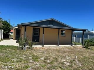 124 Harrison Rd, Daytona Beach, FL 32118 - rear view of property with fence