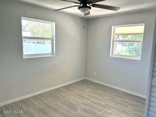 124 Harrison Rd, Daytona Beach, FL 32118 - spare room featuring baseboards, ceiling fan, and wood finished floors
