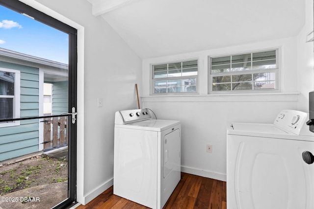 clothes washing area with laundry area, separate washer and dryer, wood finished floors, and a wealth of natural light