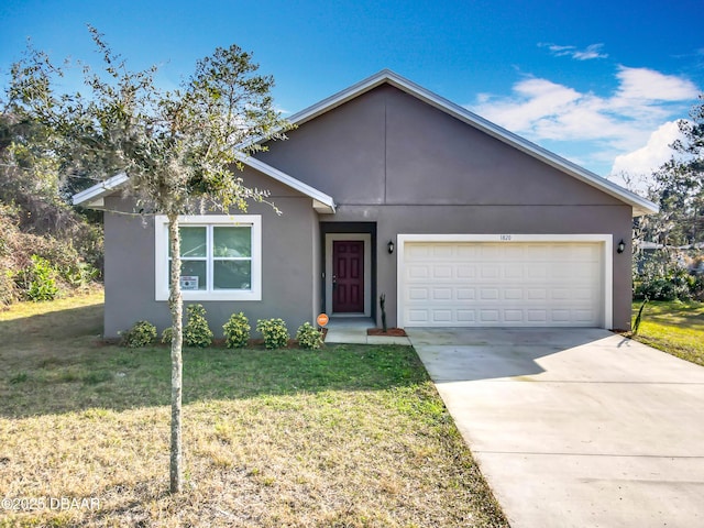 single story home featuring a front yard, driveway, an attached garage, and stucco siding