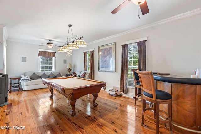 rec room featuring light hardwood / wood-style floors, plenty of natural light, and crown molding