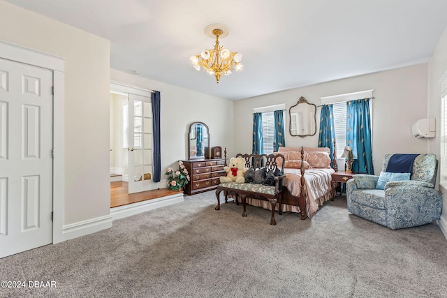 bedroom featuring carpet and an inviting chandelier