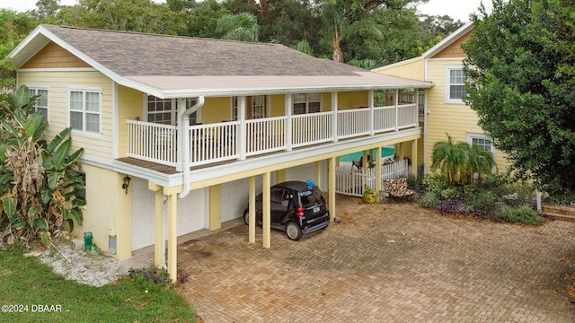 back of house with a garage