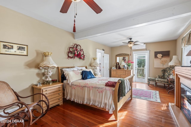 bedroom featuring dark hardwood / wood-style floors, ceiling fan, beam ceiling, and access to outside