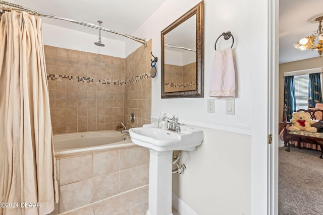 bathroom featuring shower / tub combo, an inviting chandelier, and tile patterned floors