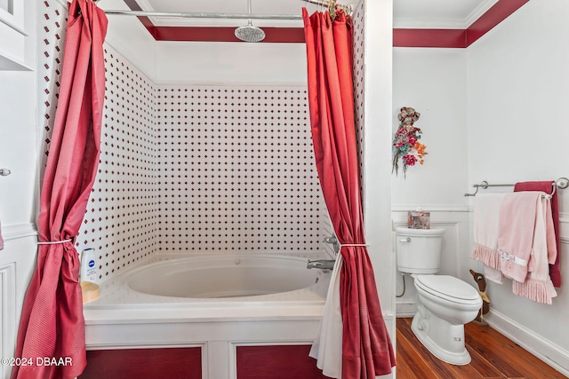 bathroom with hardwood / wood-style floors, shower / tub combo, toilet, and crown molding