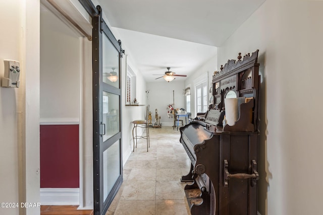 hall featuring a barn door