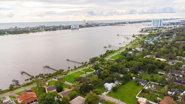 birds eye view of property with a water view