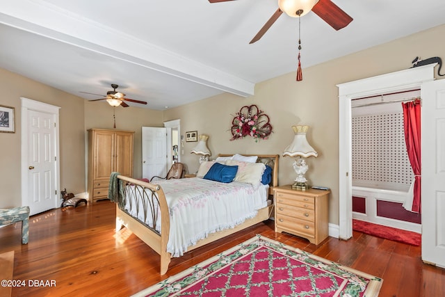 bedroom featuring beamed ceiling, ceiling fan, and dark wood-type flooring