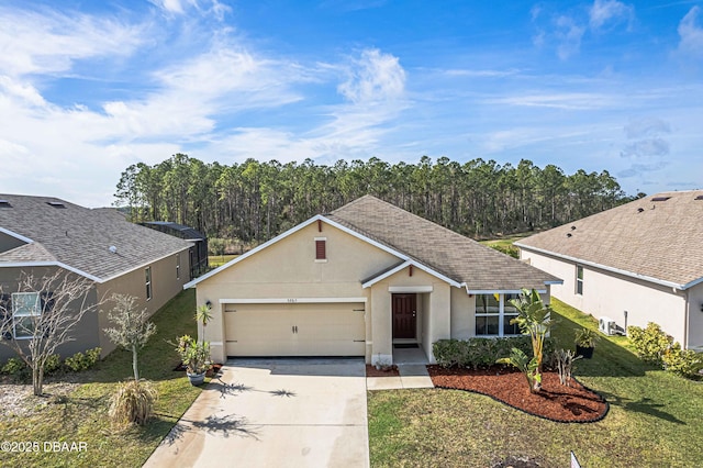 ranch-style home featuring a garage and a front yard