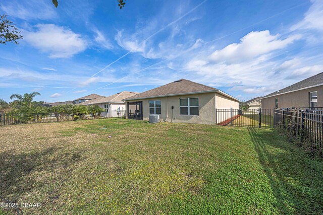 back of property featuring a lawn