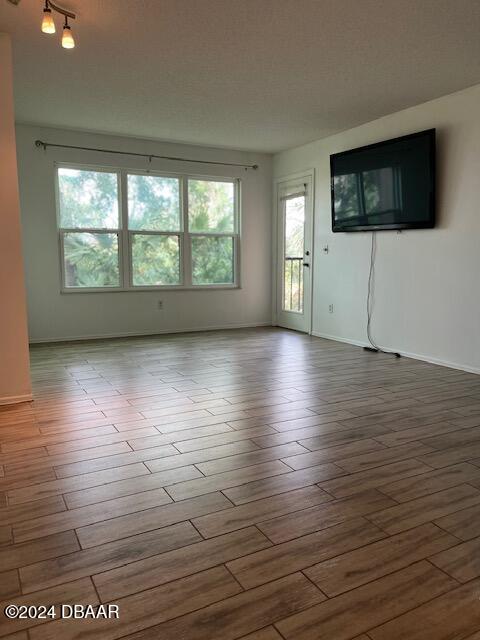 unfurnished room featuring light hardwood / wood-style floors