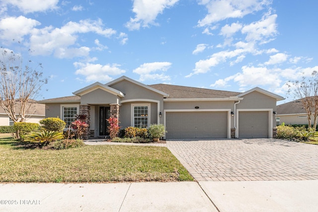 ranch-style house with a garage and a front yard