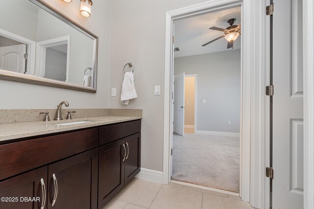 bathroom featuring tile patterned flooring, vanity, and ceiling fan