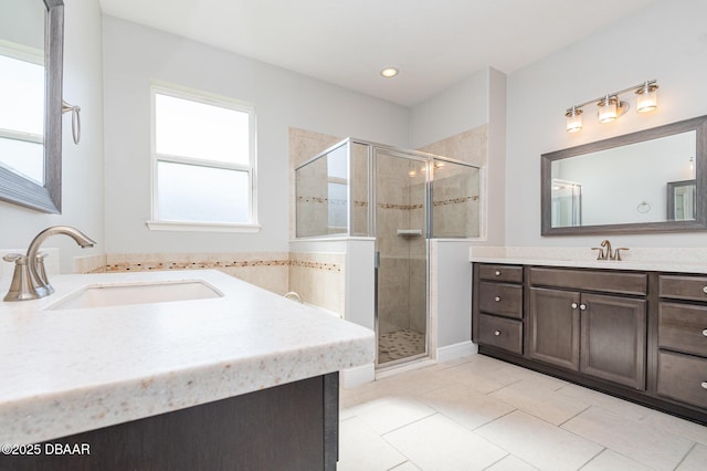 bathroom featuring vanity, tile patterned flooring, and walk in shower