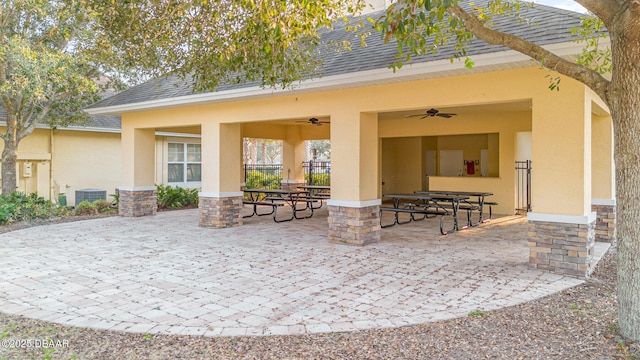 view of patio featuring ceiling fan and central AC unit