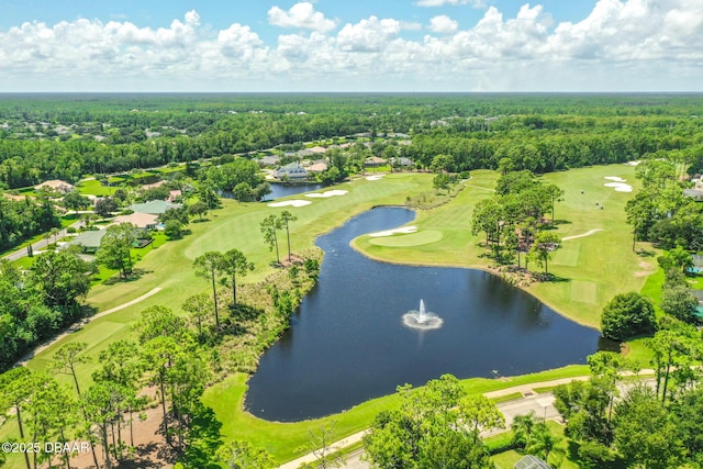 birds eye view of property featuring view of golf course, a water view, and a view of trees