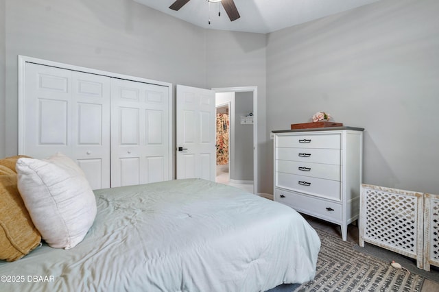 bedroom with ceiling fan and a closet