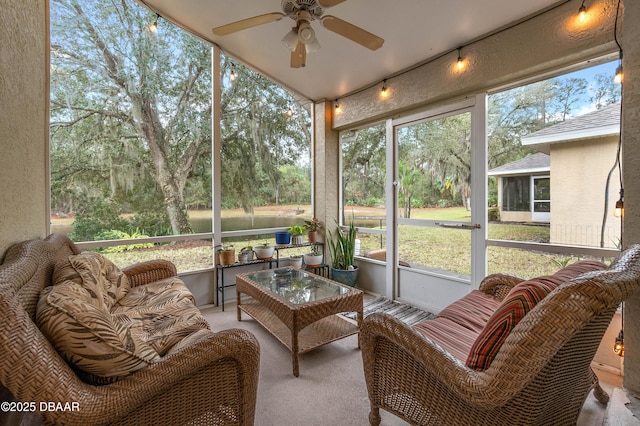 sunroom with plenty of natural light and ceiling fan