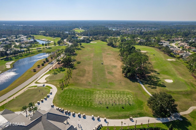 birds eye view of property featuring golf course view and a water view