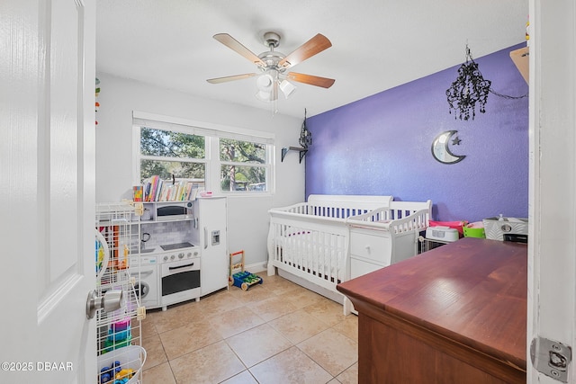 tiled bedroom with a ceiling fan