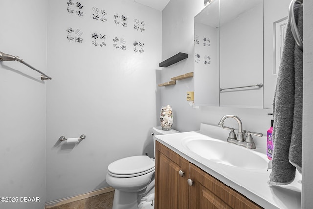 bathroom featuring toilet and vanity