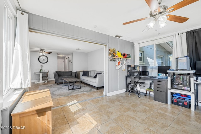 office featuring visible vents, ceiling fan, baseboards, and tile patterned floors