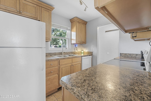 kitchen with white appliances, light tile patterned floors, extractor fan, and a sink