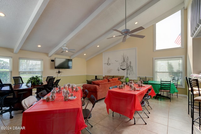 interior space featuring light tile patterned floors, vaulted ceiling with beams, a textured ceiling, and ceiling fan