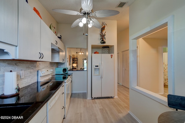 kitchen with white cabinets, white appliances, light hardwood / wood-style floors, and ceiling fan