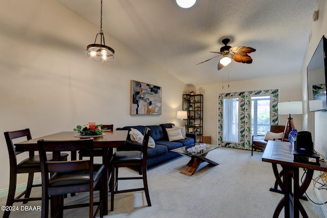 carpeted living room with a textured ceiling, ceiling fan, and lofted ceiling