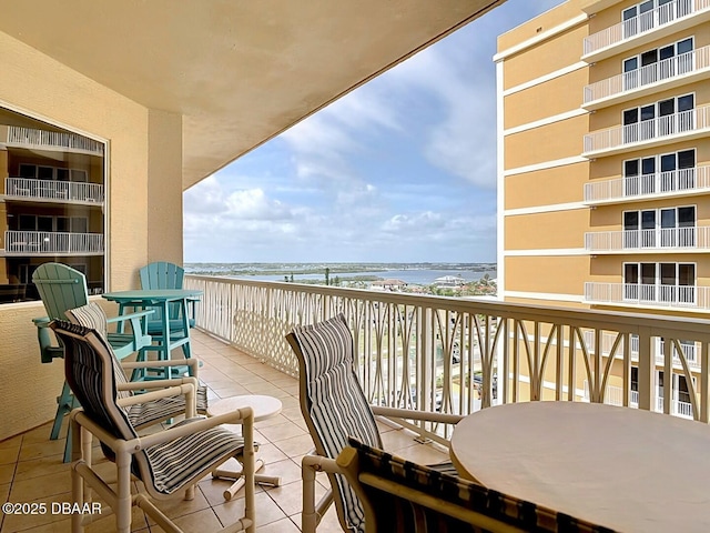 balcony featuring a water view