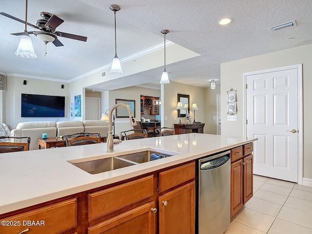 kitchen with open floor plan, visible vents, a sink, and stainless steel dishwasher