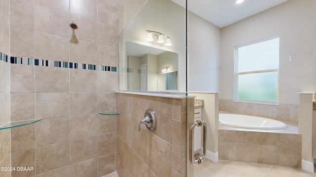 bathroom with vanity, tile patterned flooring, and plus walk in shower