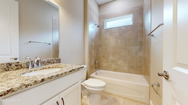 full bathroom featuring toilet, tiled shower / bath combo, vanity, and tile patterned floors