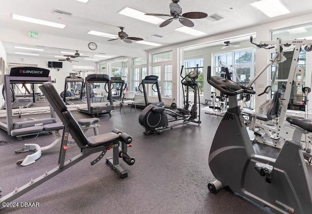 workout area featuring a textured ceiling