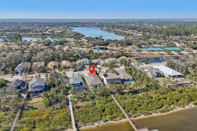 drone / aerial view with a water view