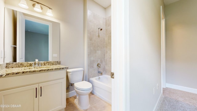 full bathroom with tile patterned flooring, vanity, toilet, and tiled shower / bath combo