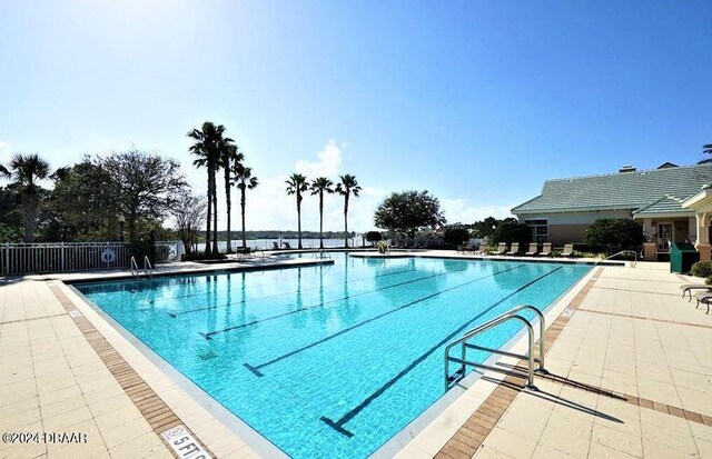 view of swimming pool featuring a patio area