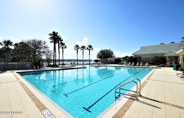 view of swimming pool featuring a patio area