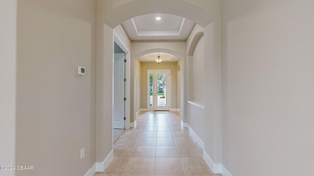 living room featuring beamed ceiling, coffered ceiling, a notable chandelier, and light hardwood / wood-style floors